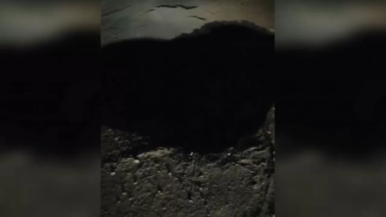 В Караганде в центре трассы образовалась трехметровая дыра
