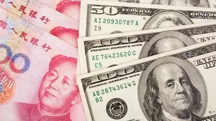 Курс юаня к доллару упал до минимума